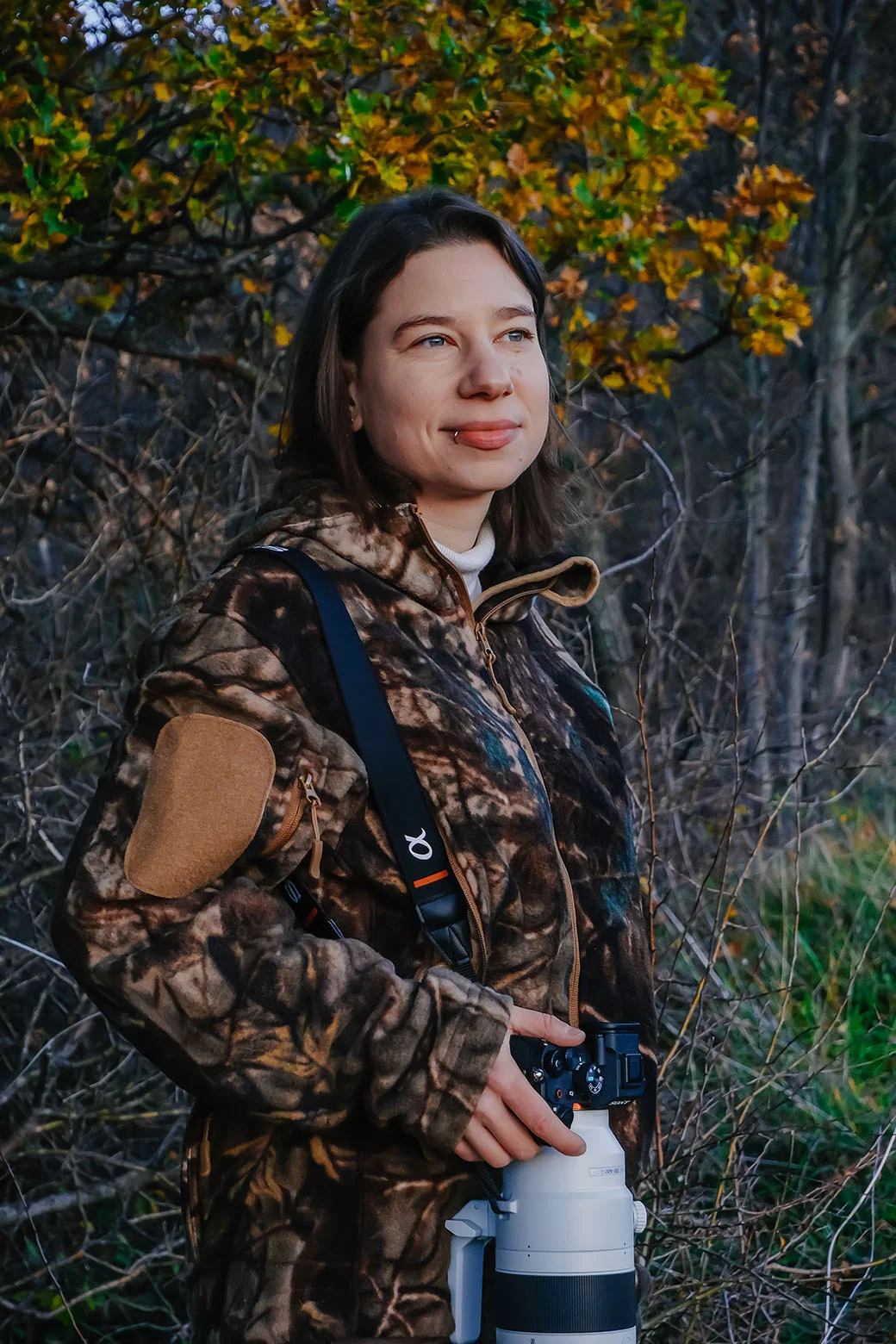 Kasia Nadrowska with her camera in the forest